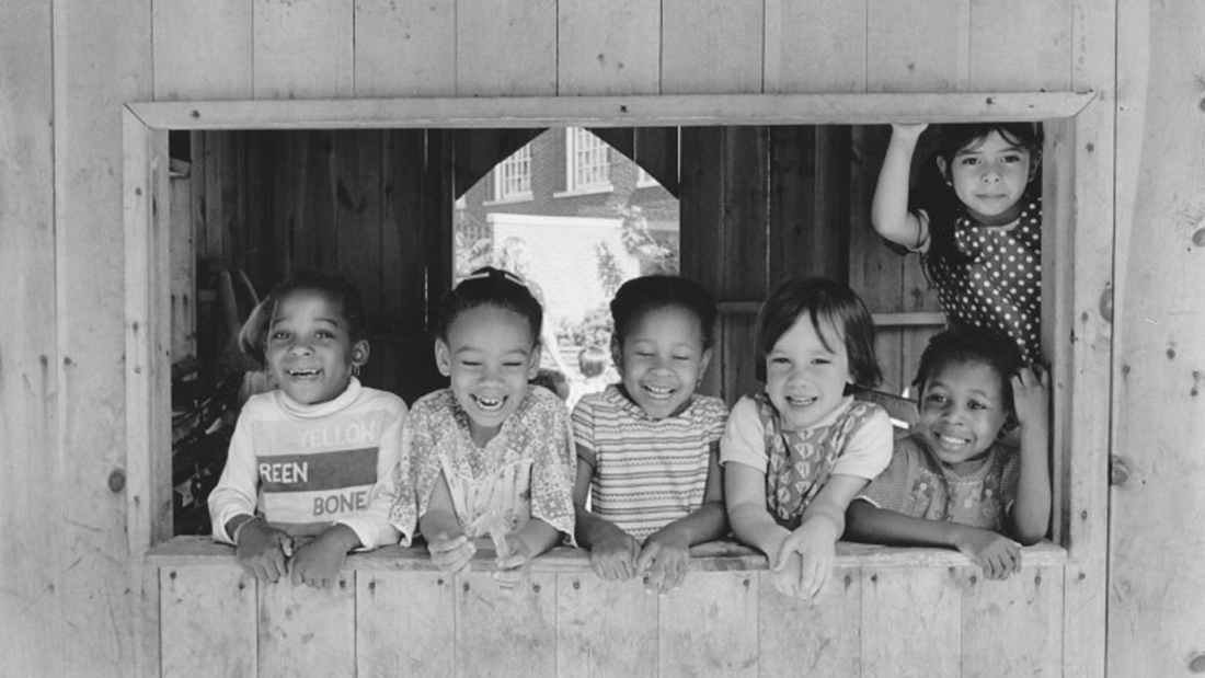 children playing in a barn