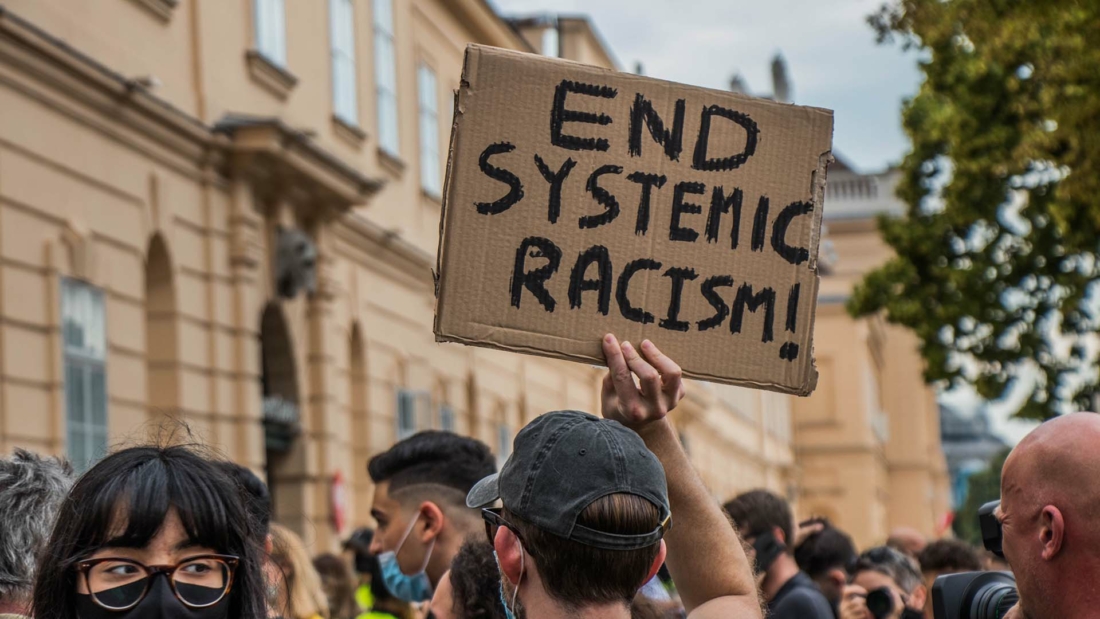 end systemic racism protest sign